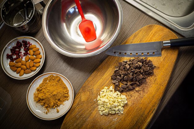 Photo woman cooking tasty melted chocolate on table in kitchen delicious dessert made of homemade chocolat