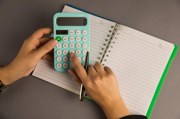 Woman counting with a calculator