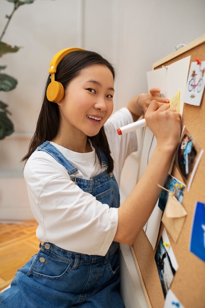 Woman creating their own vision board