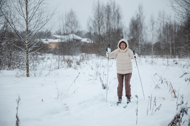 A woman on crosscountry skiing in a winter forest a healthy lifestyle concept a sporty lifestyle