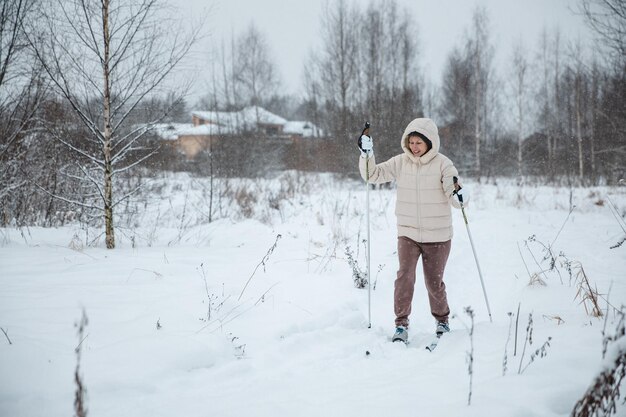 A woman on crosscountry skiing in a winter forest a healthy lifestyle concept a sporty lifestyle