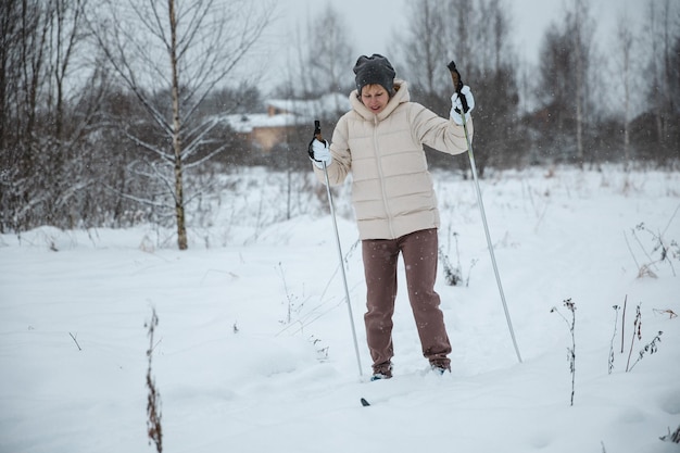 A woman on crosscountry skiing in a winter forest a healthy lifestyle concept a sporty lifestyle