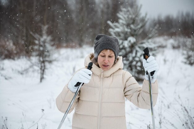 A woman on crosscountry skiing in a winter forest a healthy lifestyle concept a sporty lifestyle