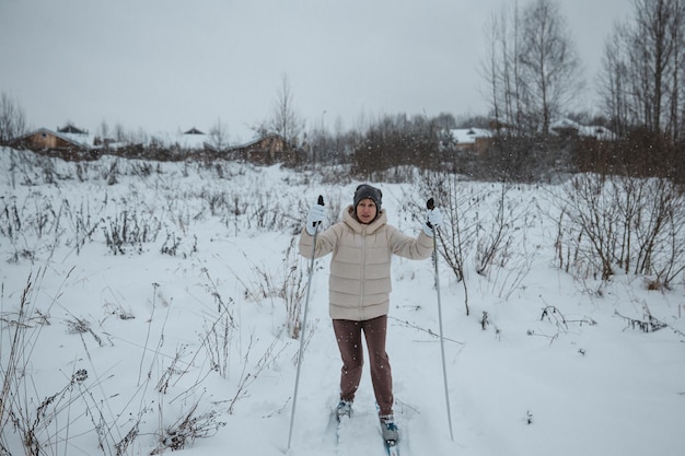 A woman on crosscountry skiing in a winter forest a healthy lifestyle concept a sporty lifestyle