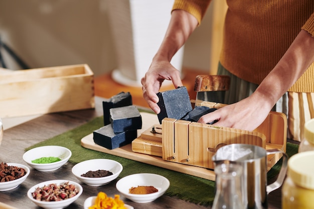 Woman cutting handmade soap