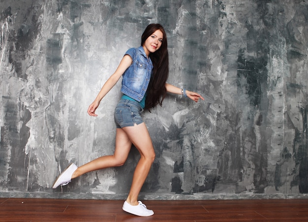 Woman in denim clothes posing