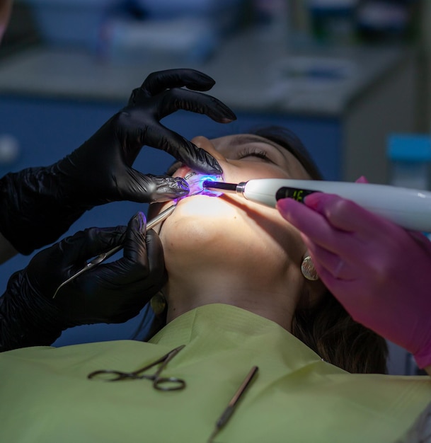 A woman at a dentist39s appointment to replace arches with braces