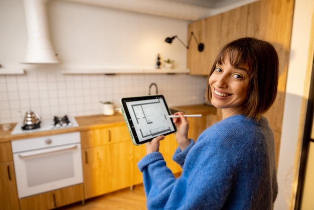 Woman designing interior with a digital tablet