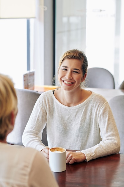 Woman discussing news with mother