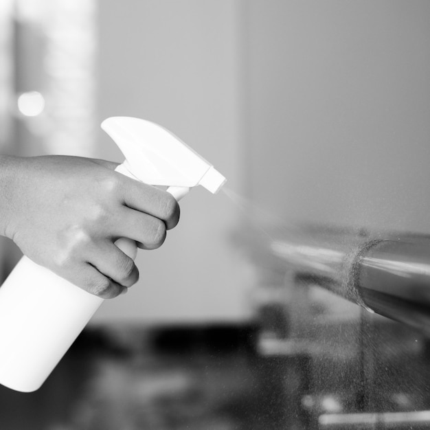 Woman disinfecting the railings during coronavirus outbreak