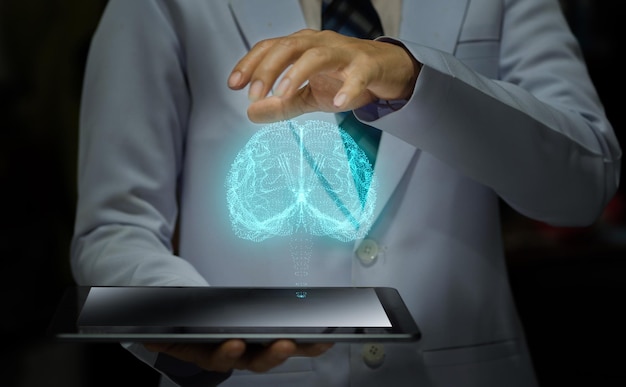 Woman doctor holding smart device with futuristic hologram