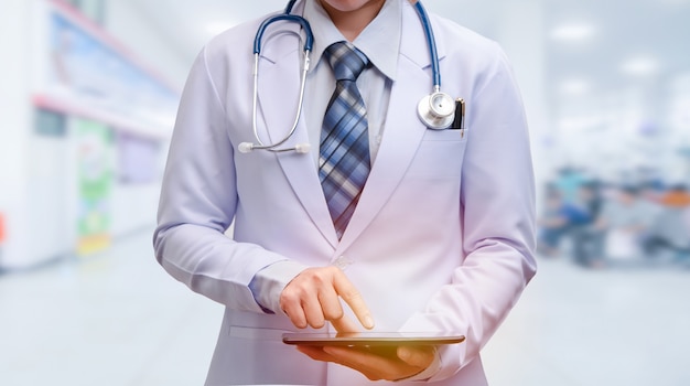 woman doctor holding smart device