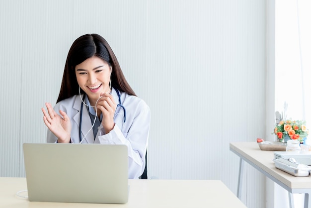 Woman doctor Looking at and using a computer notebook To advice patients By communication online