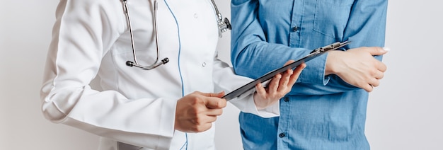 Woman at doctor at reception to check health