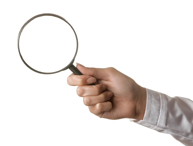 Woman doctor's hand is holding a magnifying glass on a white isolated background hand gestures