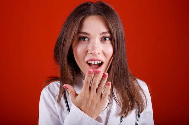 Woman doctor showing different emotions on red background