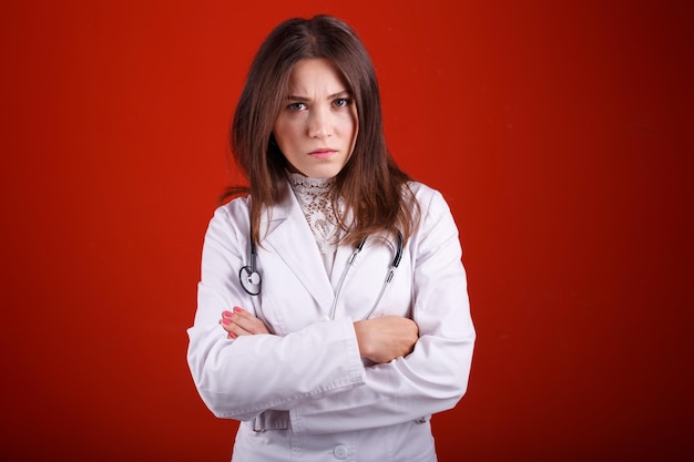 Woman doctor showing different emotions on red background