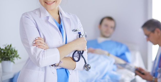 Woman doctor standing with stethoscope at hospital