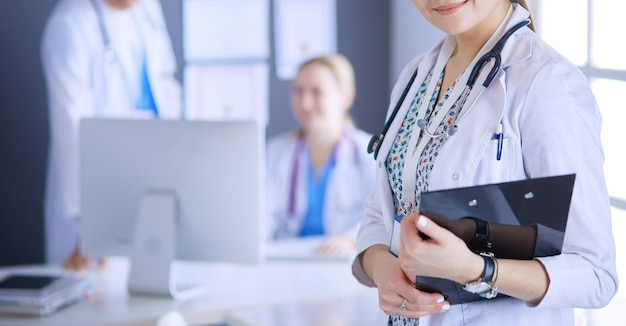 Woman doctor standing with stethoscope at hospital