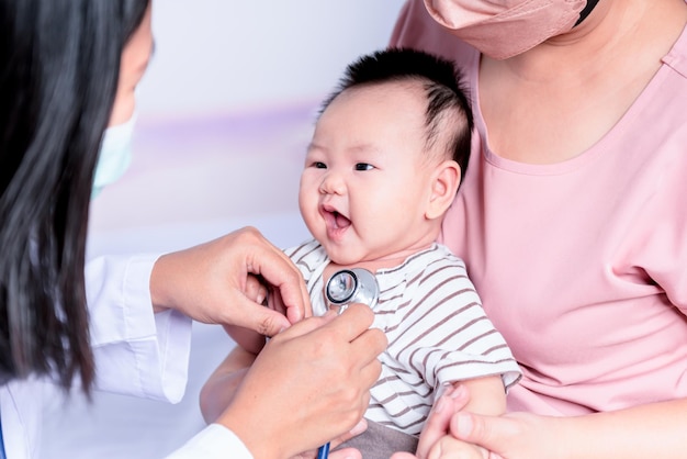 Woman doctor a stethoscope checking the respiratory system and heartbeat