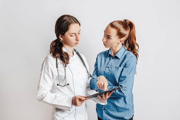 Woman at doctor on white isolated space