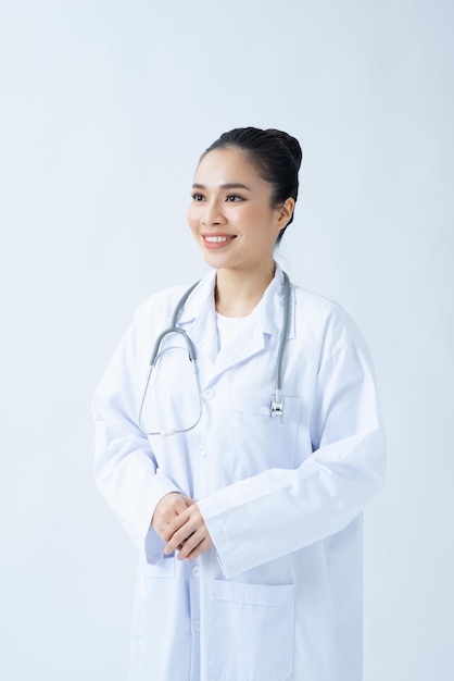 Woman doctor in white uniform standing with crossed arms isolated female portrait