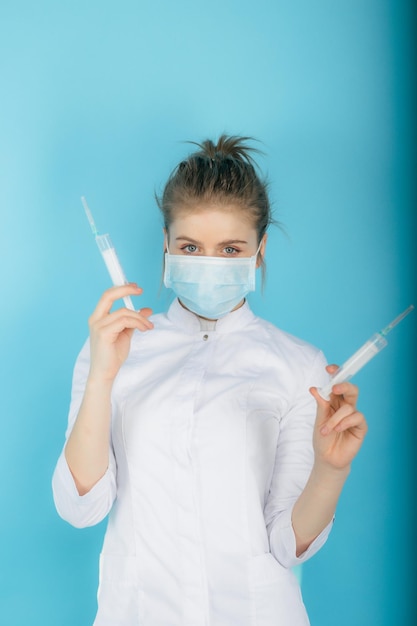 Woman doctor with syringe