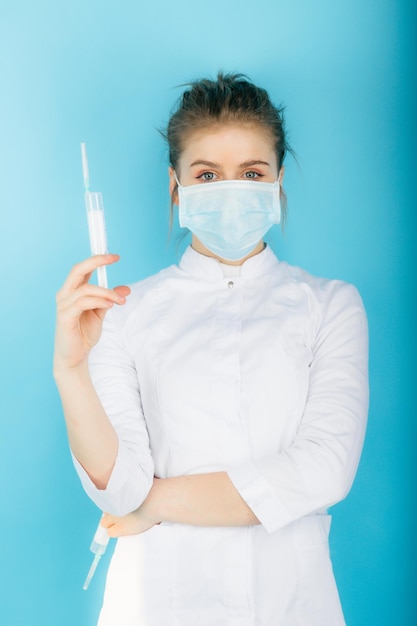 Woman doctor with syringe