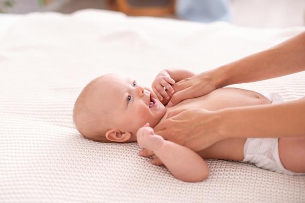 woman doing exercises with child for its development