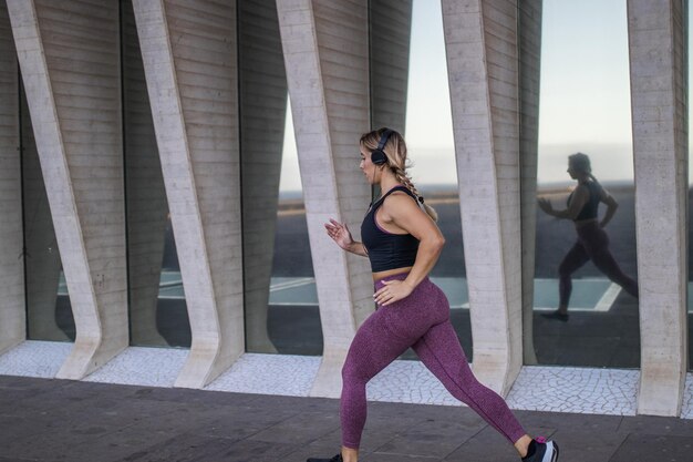 Woman doing jogging reflected in the mirror