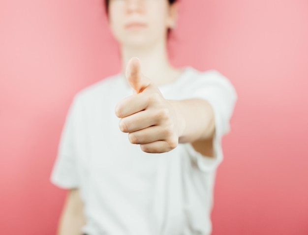 Woman doing the ok all good sign to camera over a pink background help and self help concept mental health Good new concept be happy