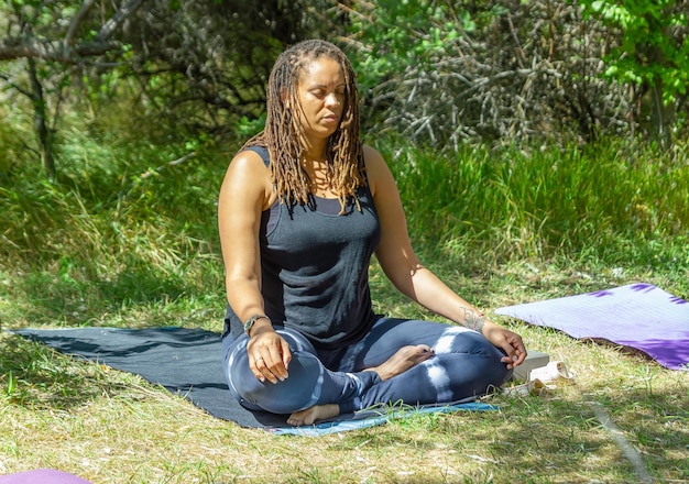 woman doing yoga exercise on the beach woman relaxing on the beach woman doing yoga