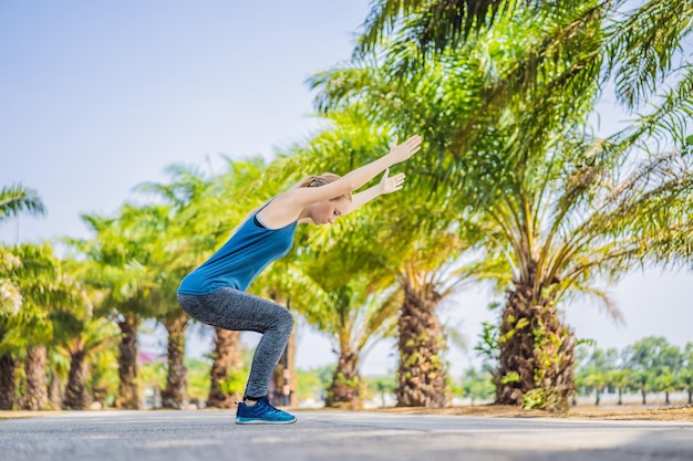 Woman doing yoga in a tropical park