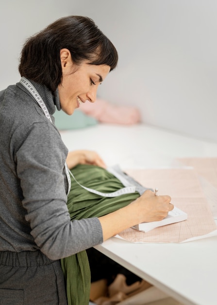 Woman drawing sketch of clothes