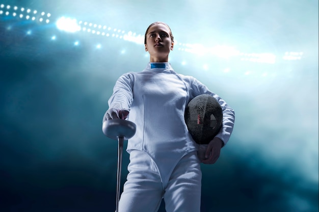 Woman dressed as a fencer posing with a mask and a sword