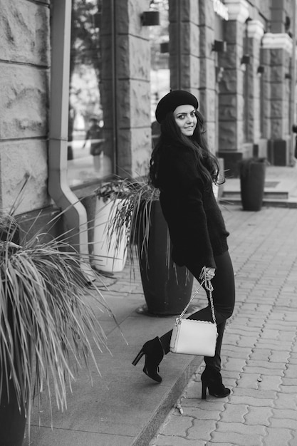 Woman dressed in retro style walking around the city