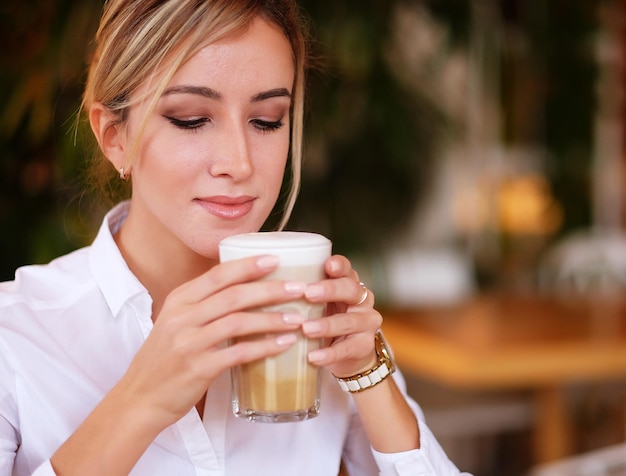 Woman drinking coffee in the morning at restaurant