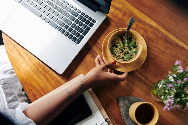 Woman eating at workplace