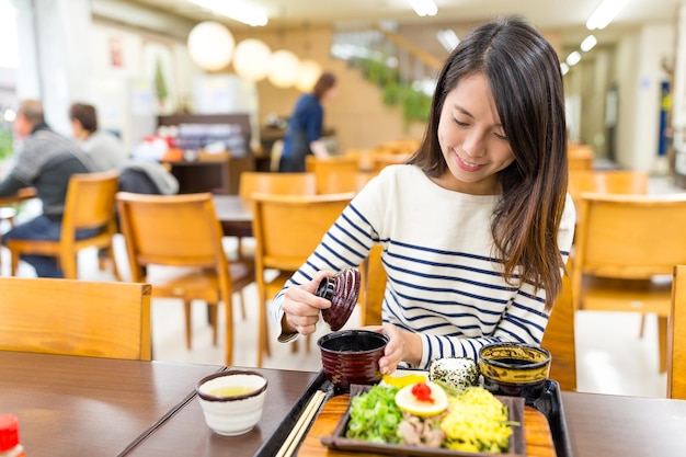 Woman enjoy her meal in restaurant