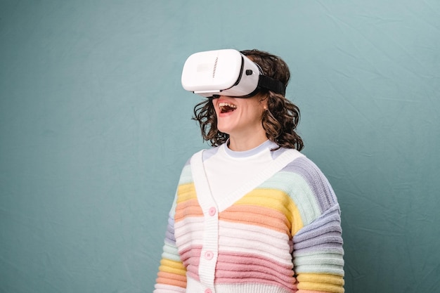 Woman enjoying experiencing virtual reality with VR headset over an isolated background