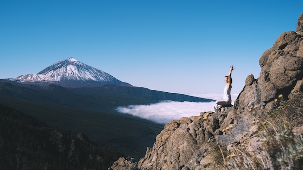 Woman enjoying nature Mount Teide volcano on Tenerife Spain Europe Concept of meditation