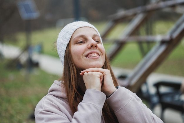 Woman Enjoying a Relaxing Day at the Park in Late Autumn