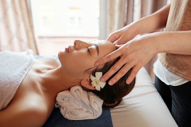 Woman enjoying spa procedures