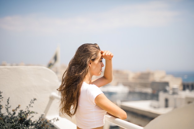 Woman enjoying the view from a terrace