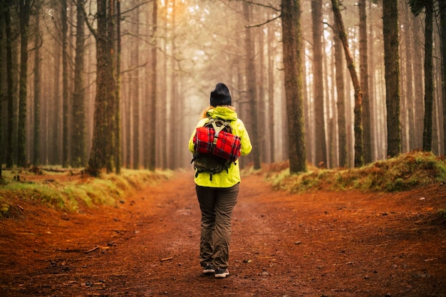 Woman enjoys the world traveling with a backpack