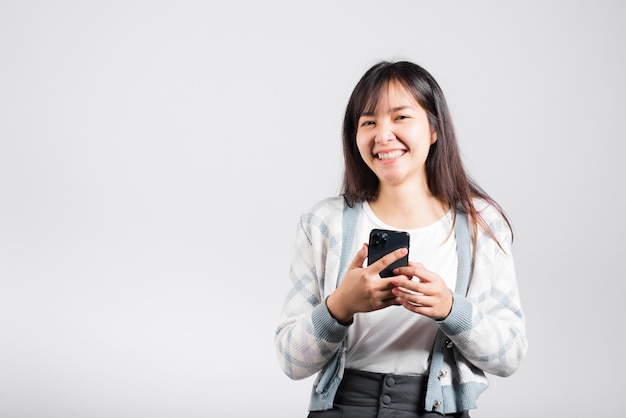 Woman excited read social network feedback on smartphone