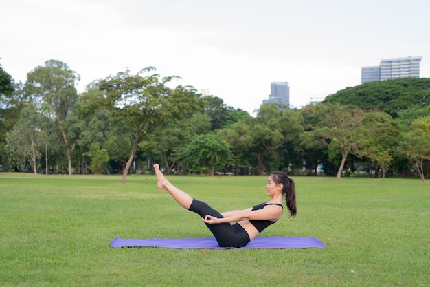 Woman Exercise Yoga In Park Ready For Healthy Lifestyle In Nature