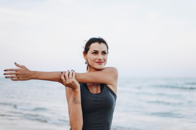 Woman exercising at the beach