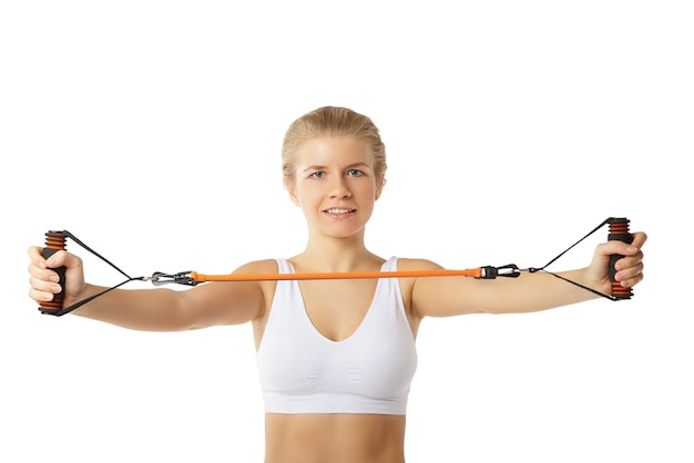 Woman exercising with resistance band on white