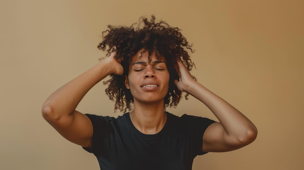 Woman Experiencing Severe Headache with Hands on Her Temples Against Plain Background